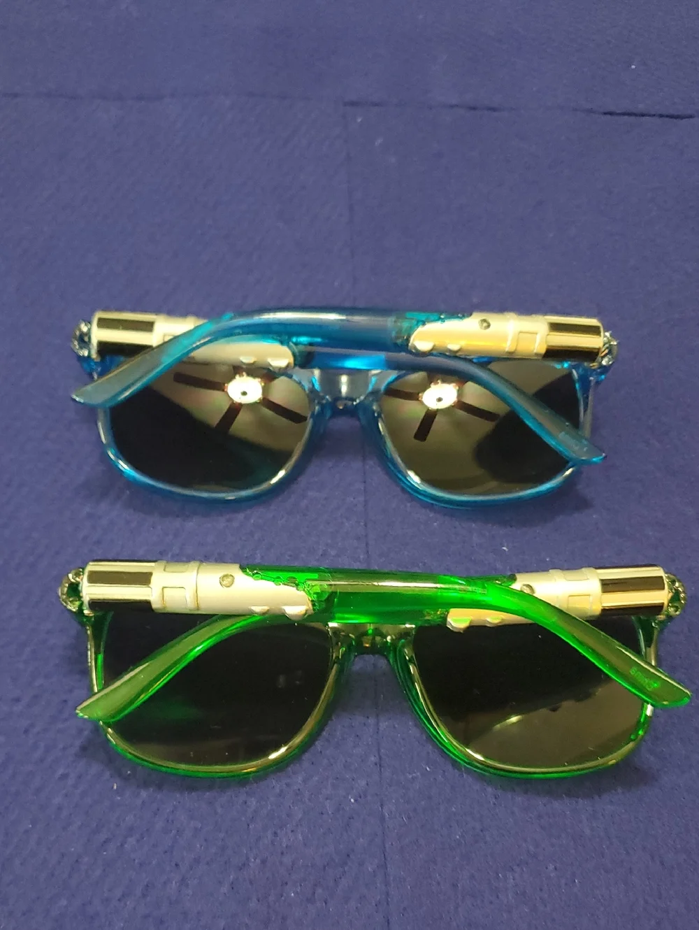 2 Pairs Kids Lightsaber Sunglasses. One Blue, One Green. Great Condition.